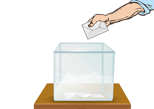 immagine di una mano che inserisce la scheda di voto nell'urna trasparente